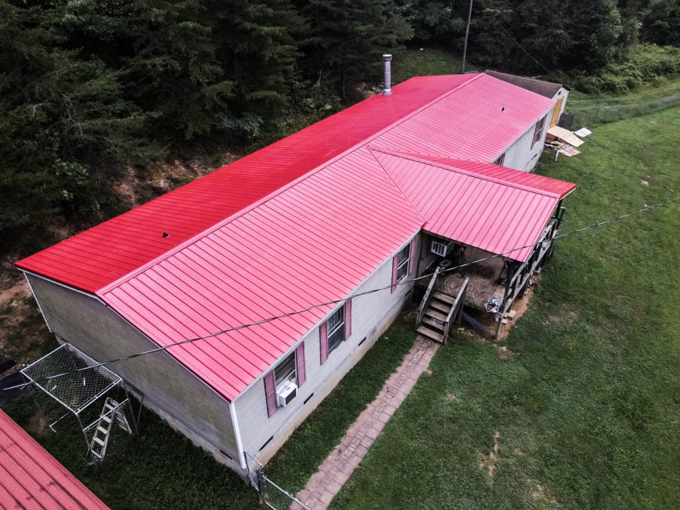 House with red metal roof exterior
