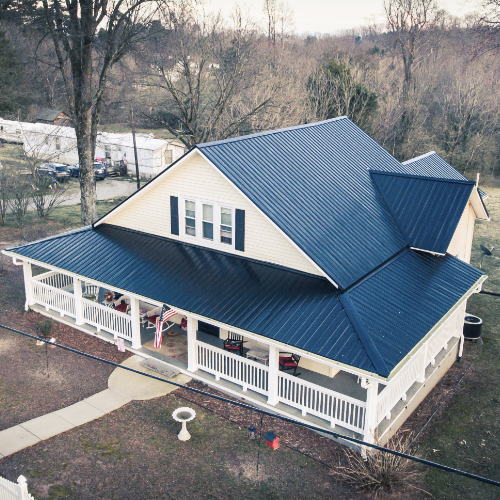 House with blue metal roof and porch