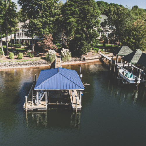 Dock on calm lake surrounded by trees
