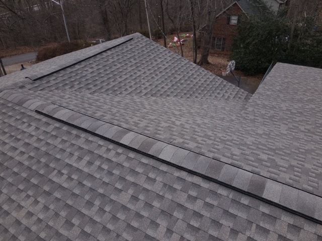 Two sloped roofs with shingles