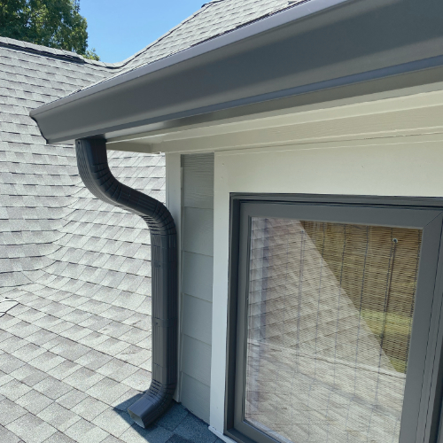 Roof with gutter and downspout