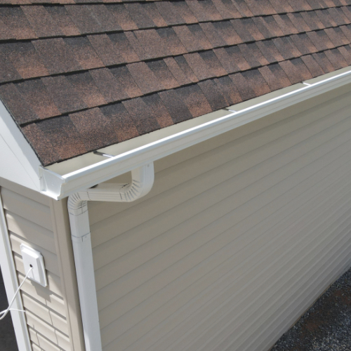 Roof with shingles and gutters
